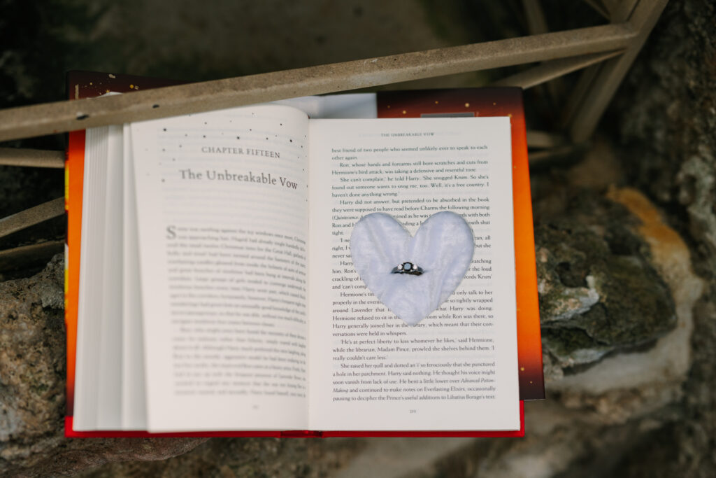 hollowed out harry potter book with the engagement ring inside