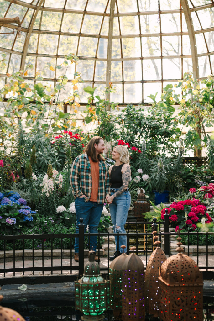 Couple holding hands during their Lincoln Park Conservatory engagement session in Chicago