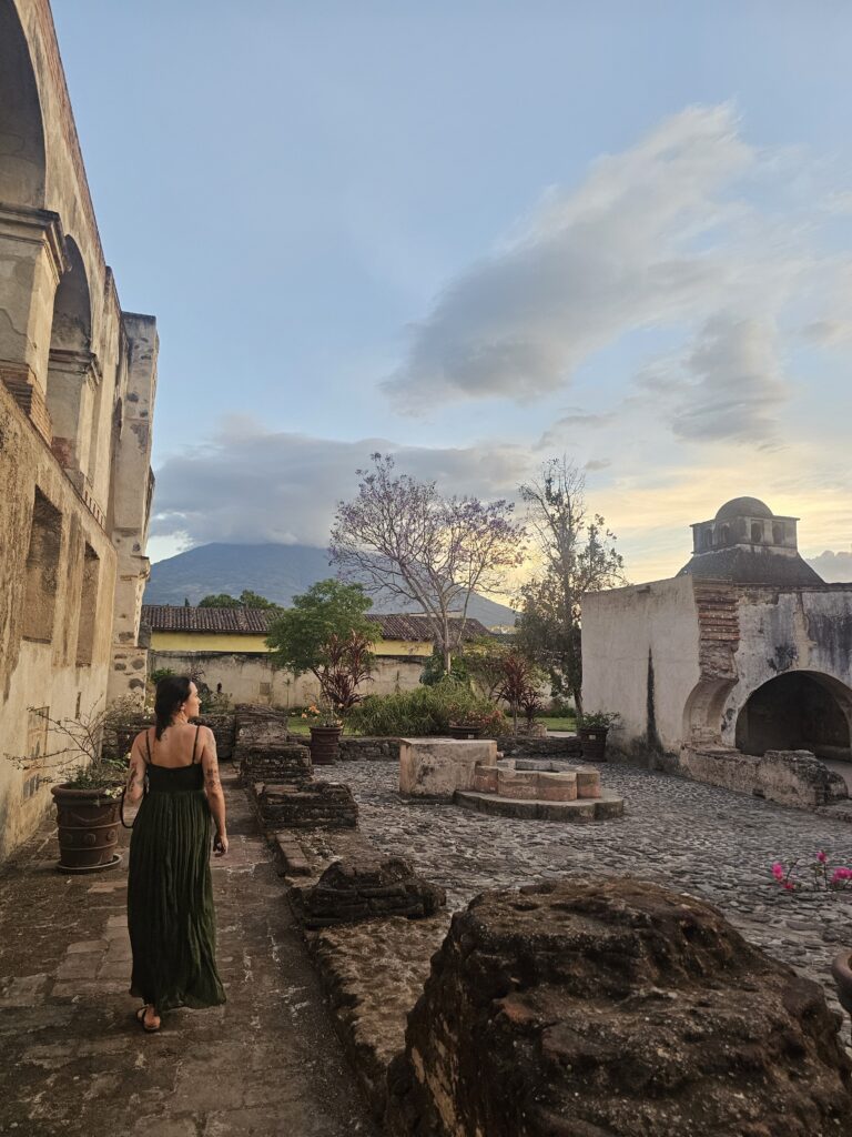 Woman walks in Santa Clara ruins Antigua Guatemala